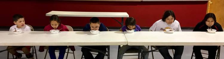 How do you eat if you can’t use your hands? The GLORY kids decided that asking for help was a good idea – and thus they learned Lakota notions about interdependence. (The Rev. Lauren R. Stanley)